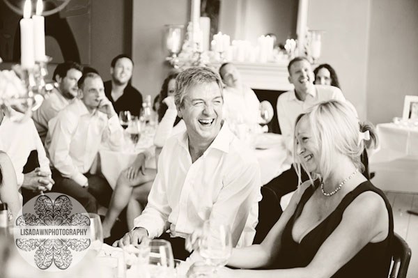 parents laughing at the best man's speech