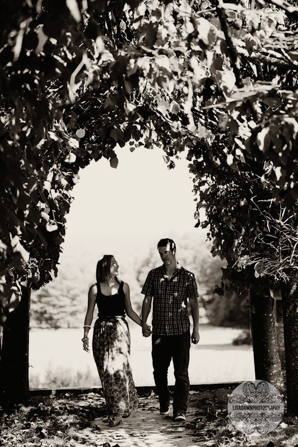 Photograph of Couple walking under trees at Rhinefield House