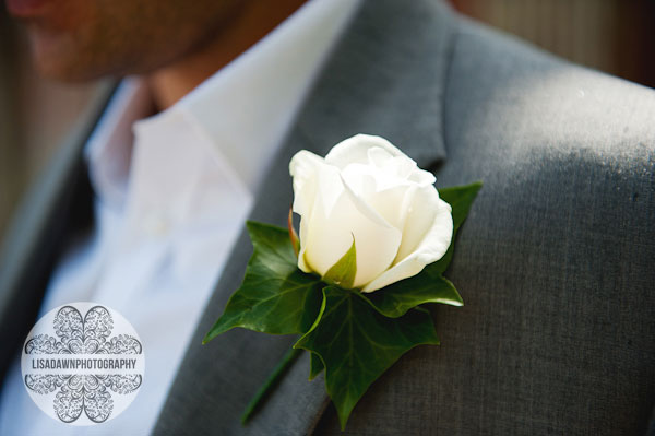 grooms button hole white rose