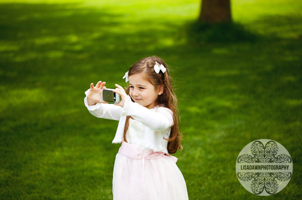 Flower girl taking a picture