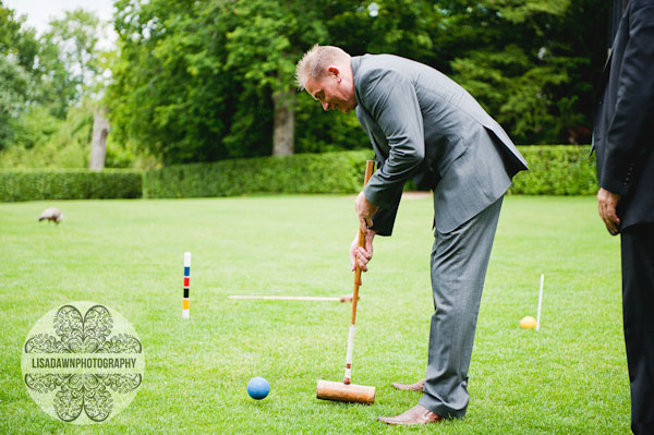 guest playing croquet on the lawn