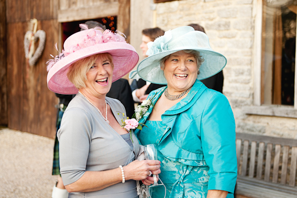 Best friend in their wedding hats