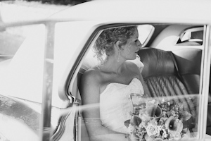 Bride in wedding car