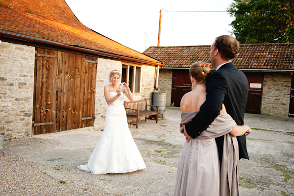 Bride taking a photograph