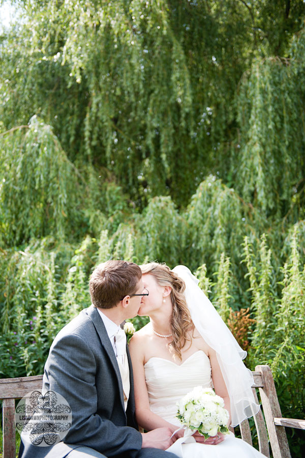 Country wedding photo of couple by weeping willow