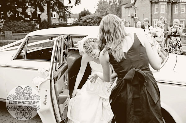 bride getting out of wedding car