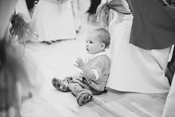 child playing with bubbles