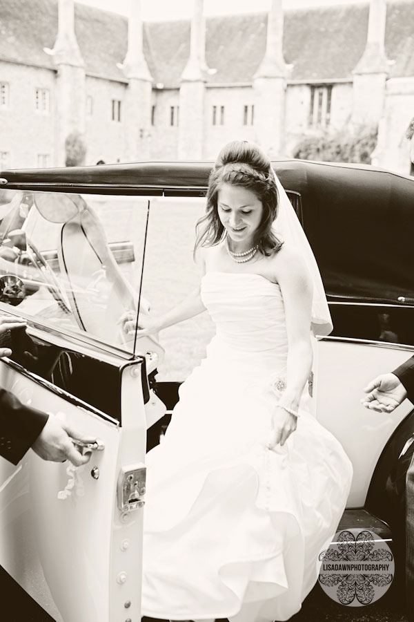 Bride getting out of vintage car