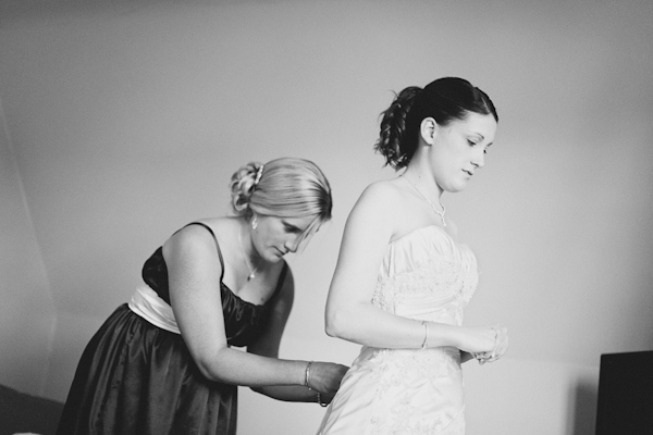 putting on the wedding dress