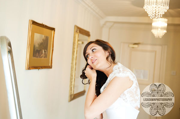 bride putting on her jewellery