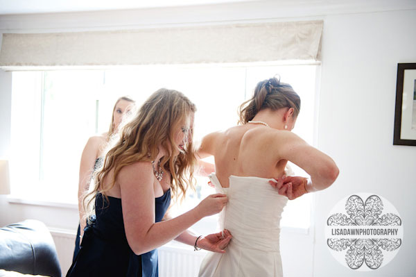 Putting on the wedding dress