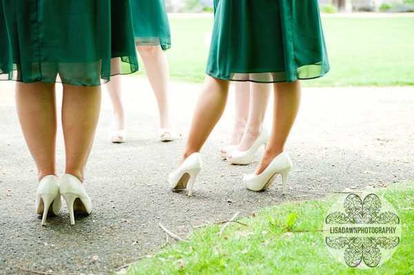 Bridesmaids green dresses and cream shoes