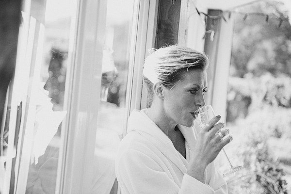 Bridesmaid drinking champagne