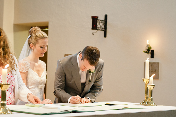 Groom signing the registar