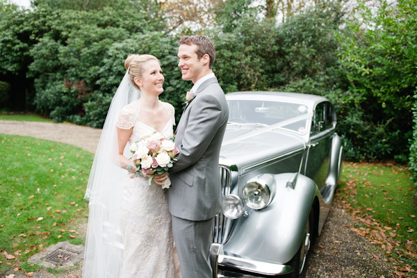 Bride and Groom with car