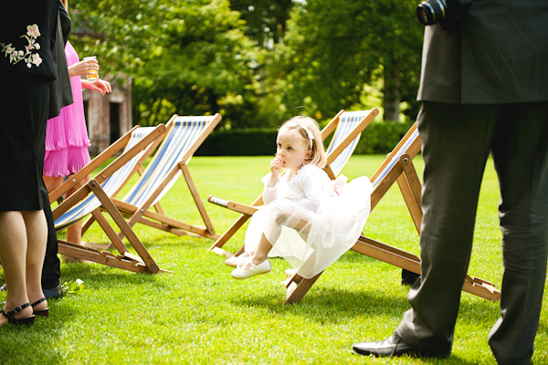 flower girl sitting on a deck chair