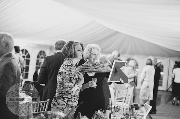 Wedding guests looking at photograph