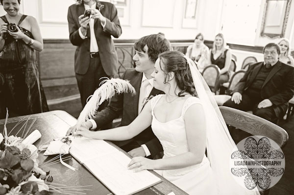 signing the register quill