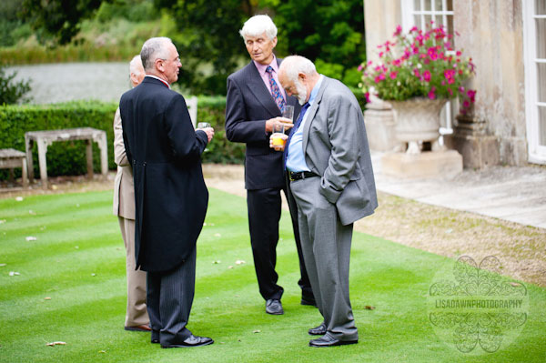 wedding guests drinking pimms on the lawn