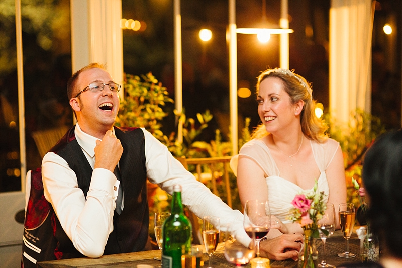 bride and groom laughing