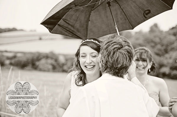 Bride underneath umbrella