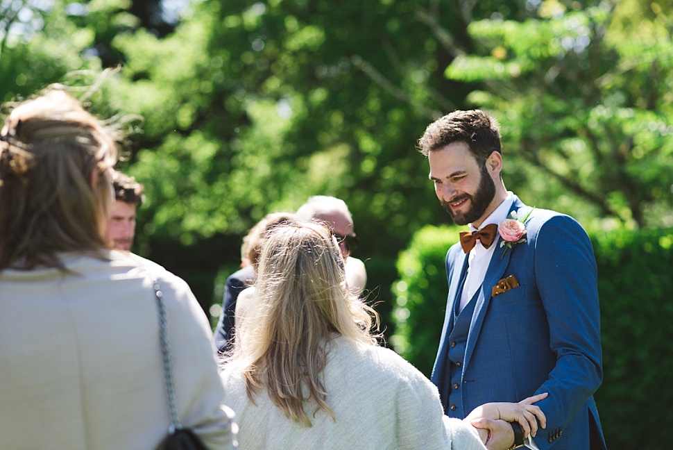 groom in blue suit