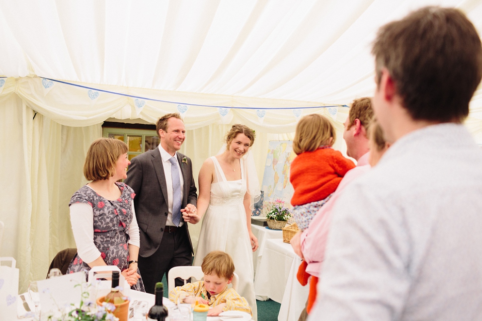 bride and groom entering reception